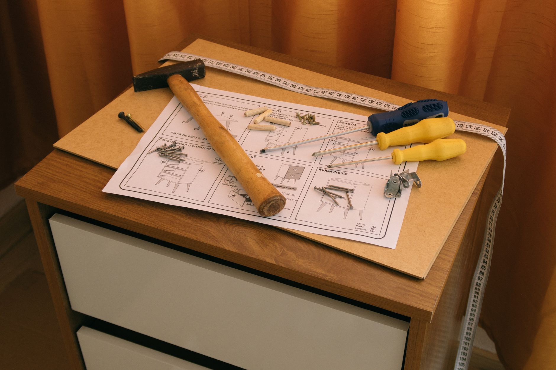 A person measuring a wall before painting